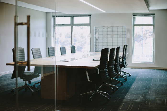 Empty boardroom representing the behavioural governance gaps directors face in Australian organisations