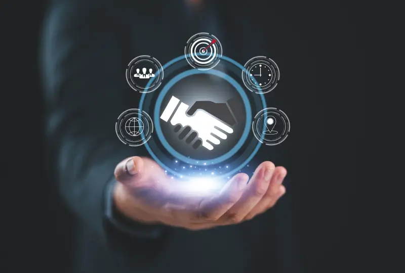 Handshake icon above a person's hand.