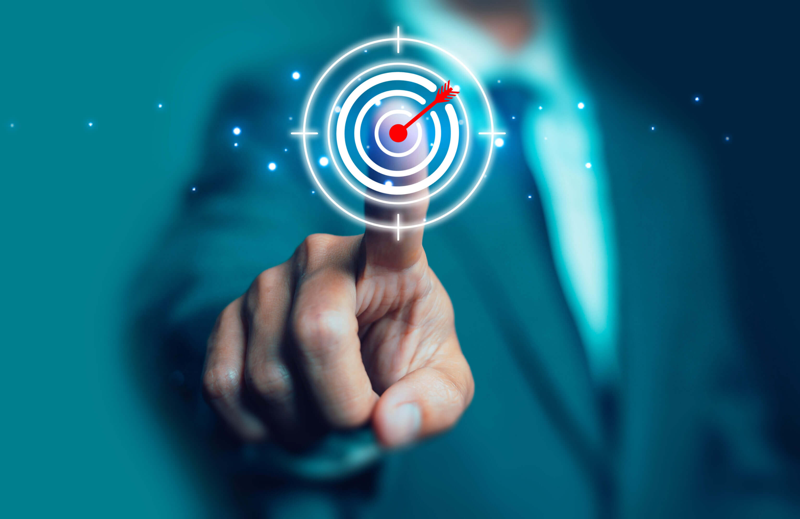 Businessman pressing a virtual target symbolizing goal achievement.